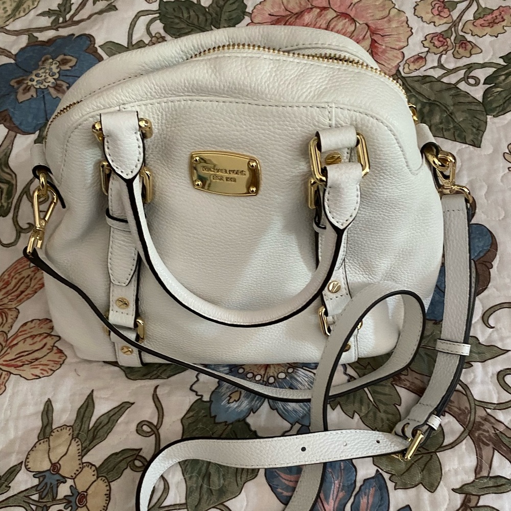 White Michael Kors purse.